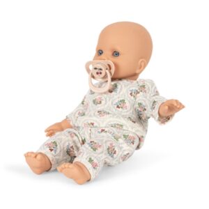 lalka niemowlę w piżamce w winogrona ze smoczkiem w buzi